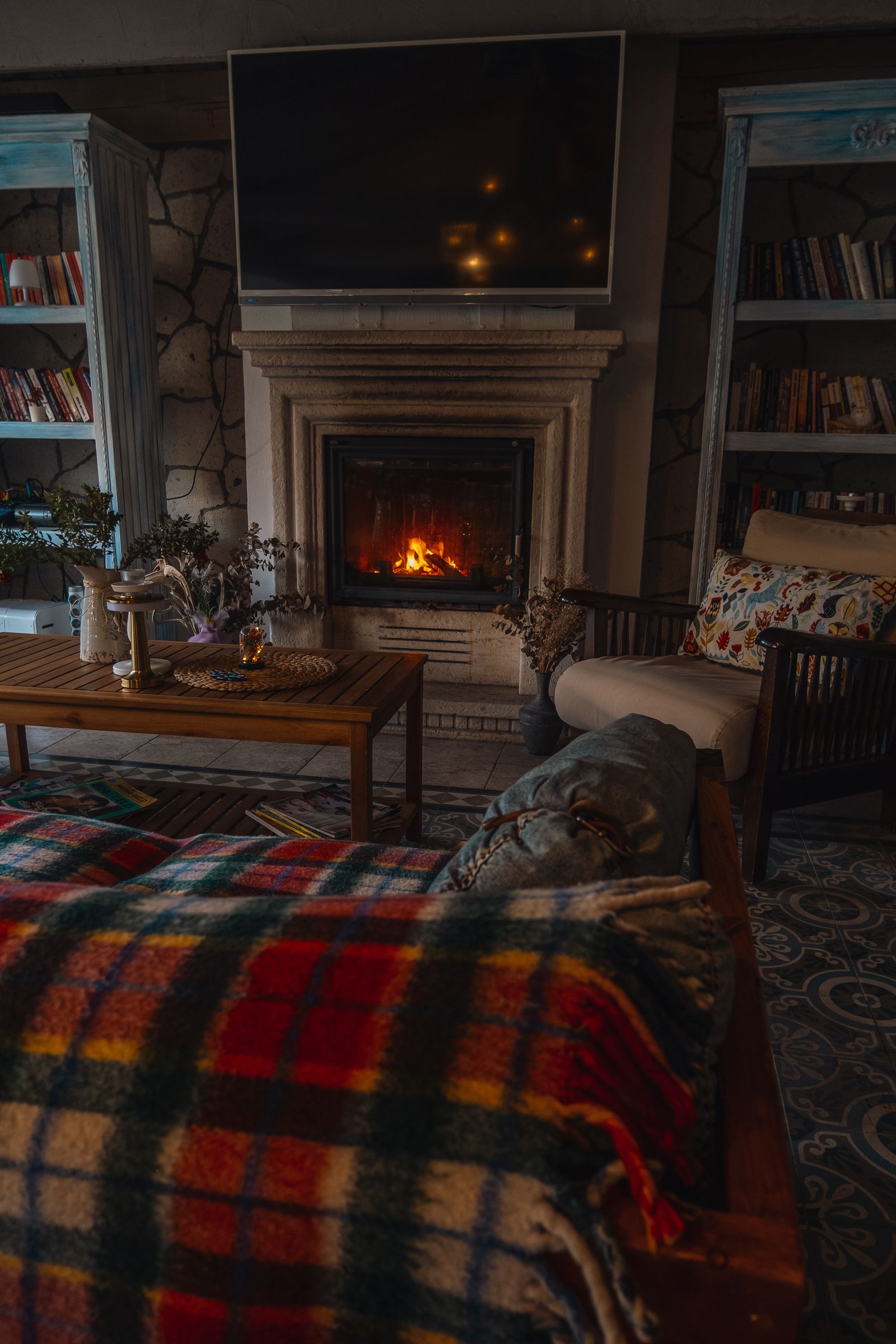 Sample image of a warm living room with a lit fireplace